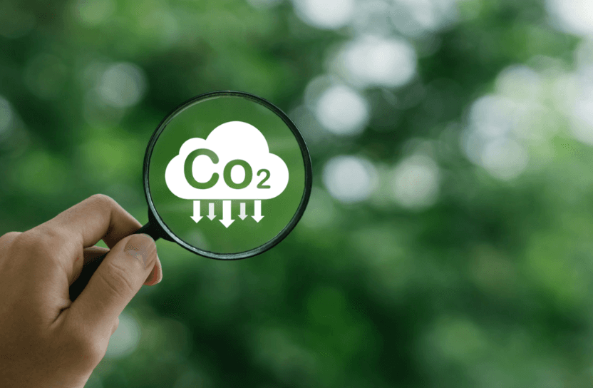 A magnifying glass looking at a cloud with the word co2.