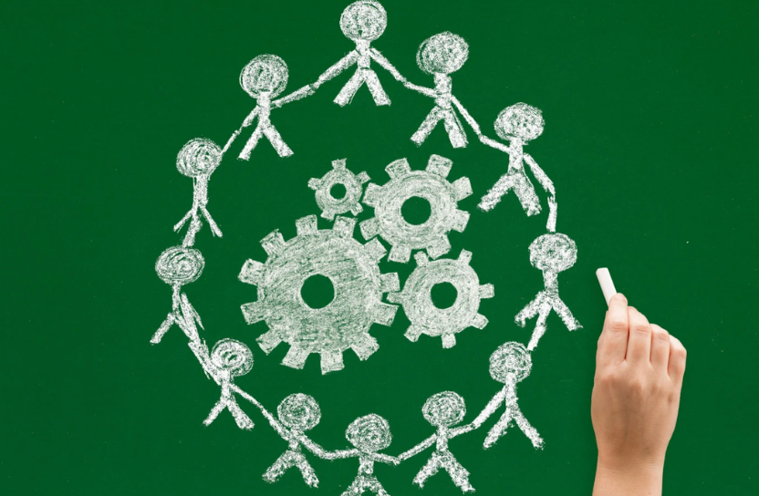 Figures drawn on a green board.