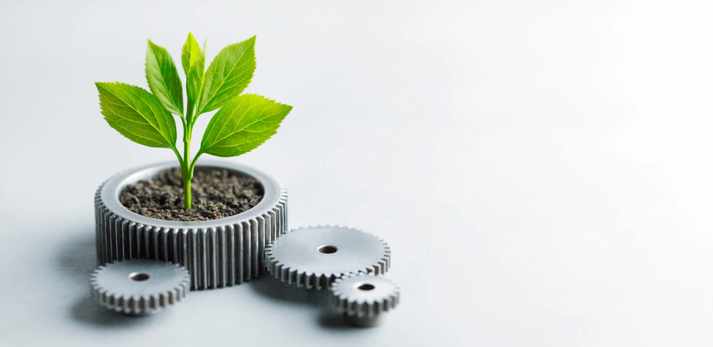 Kugghjul som det växer en planta i.