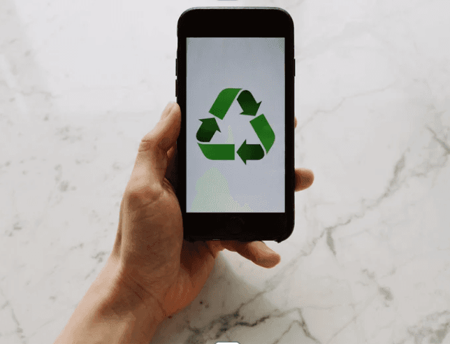 A phone with a recycling symbol on.