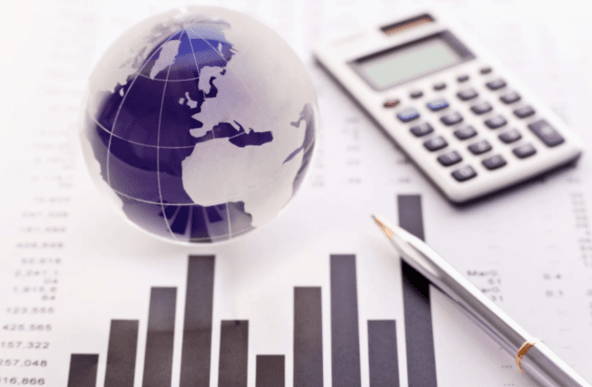 A globe, graphs, a calculator and a pen.